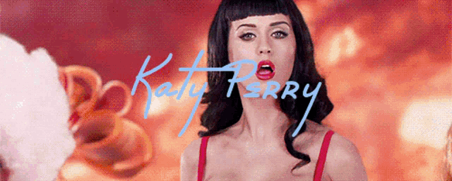 a woman in a red bra with the name katy perry written in blue