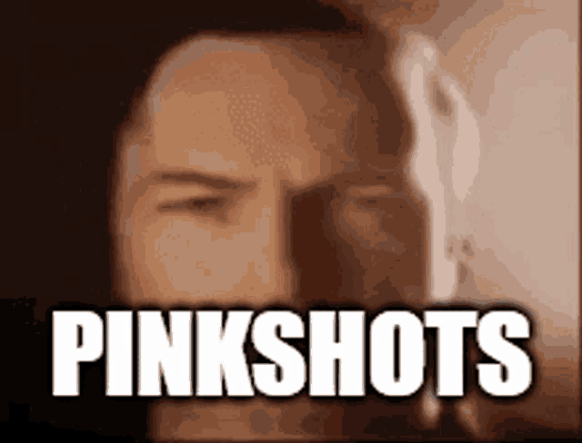 a close up of a man 's face with the words pinkshots written above him