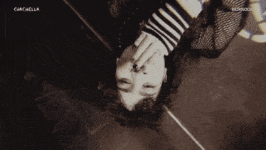 a black and white photo of a person with coachella written on the top