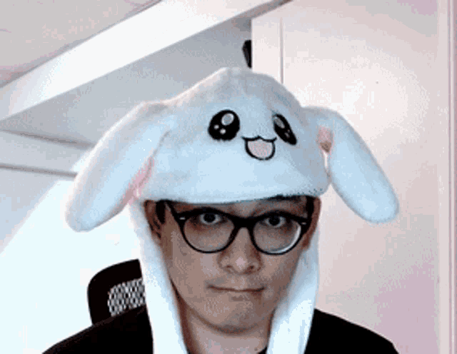a man wearing glasses and a bunny hat with moving ears