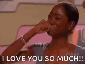 a woman is crying while holding her hand to her face and saying `` i love you so much ! ''