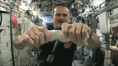 Wringing A Cloth In Space GIF - Wringing Wet Cloth GIFs