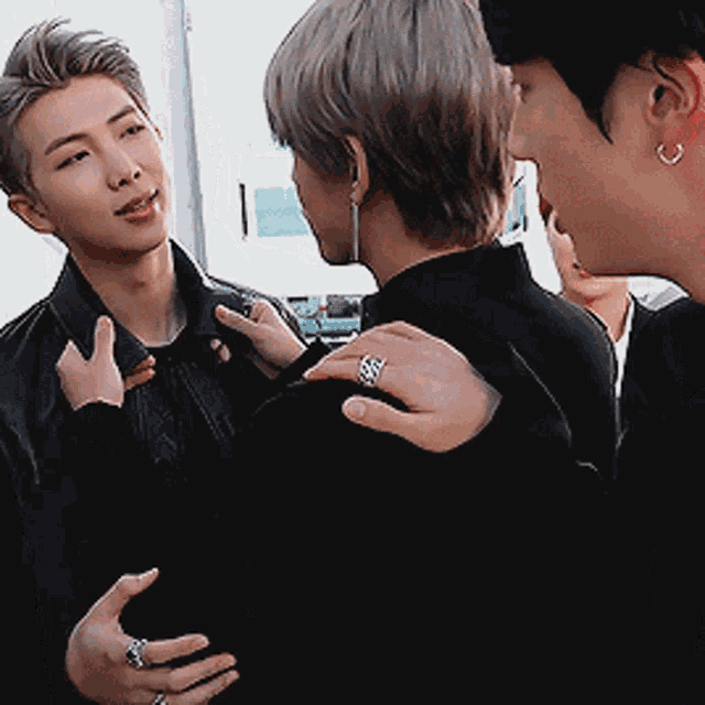 a man with a ring on his finger talks to another man