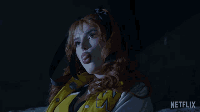 a woman blowing a bubble with the netflix logo in the background