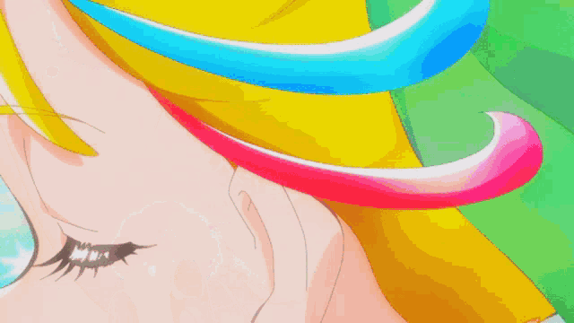 a close up of a person 's face with a rainbow colored hair