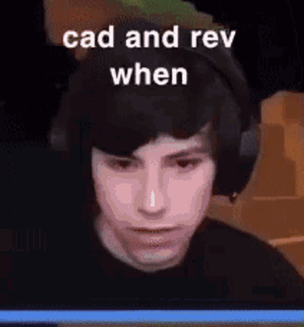 a close up of a person wearing headphones with the words cad and rev when .