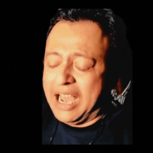 a close up of a man making a funny face