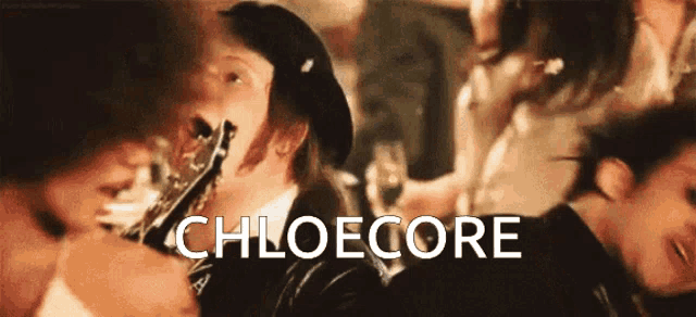 a man playing a clarinet with the word chloecore written on the bottom
