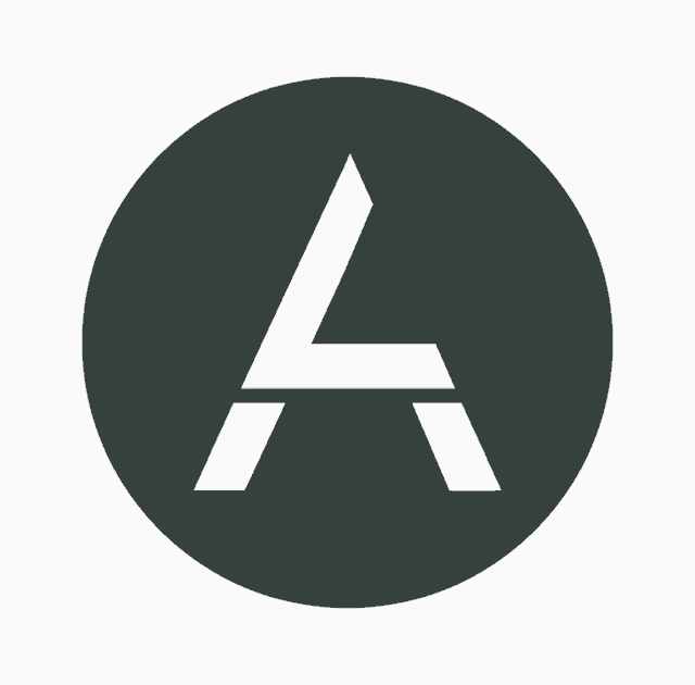 a white letter a is in a black circle