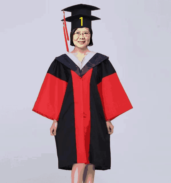 a woman wearing a graduation cap and gown has the number 1 on it