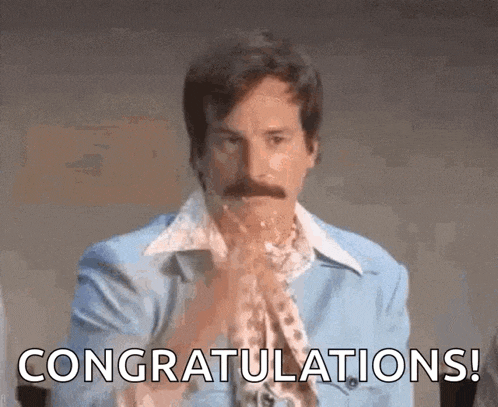 a man with a mustache is congratulating someone with his hands in the air .