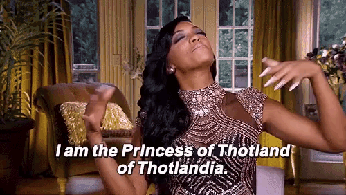 a woman in a dress is sitting on a couch and says i am the princess of thotland of thotlandia