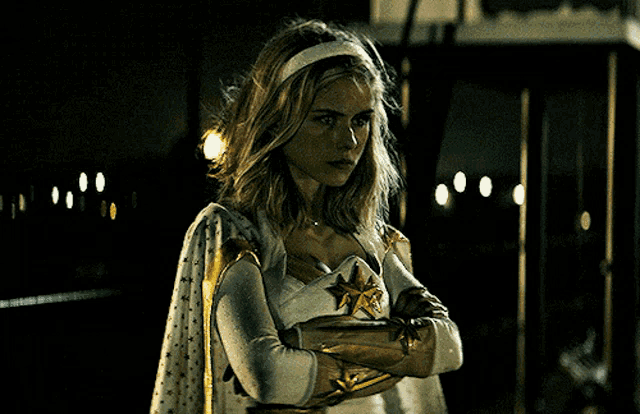 a woman in a superhero costume with a star on her chest