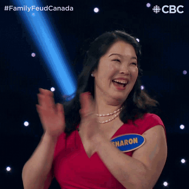 a woman with a name tag that says sharon applauds