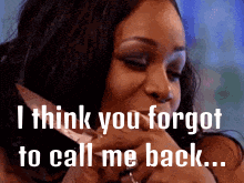 a woman is talking on a cell phone and says i think you forgot to call me back ..