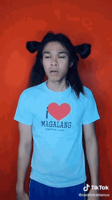 a man wearing a blue shirt that says magalang