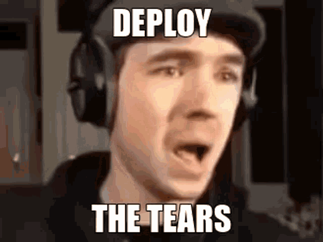 a man wearing headphones is making a funny face with his mouth open .