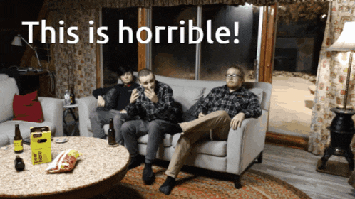 three men sit on a couch with the words " this is horrible " behind them