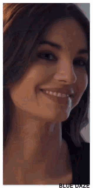 a close up of a woman 's face with the words blue daze below