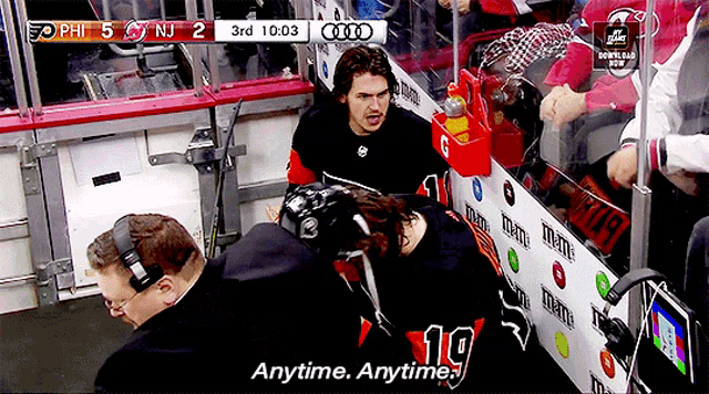 a hockey game is being played between the phillies and the flyers