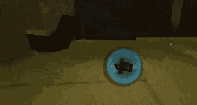 a person is standing in a room with a blue circle in the middle of it