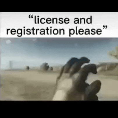 a person 's hand is reaching out towards a sign that says `` license and registration please `` .