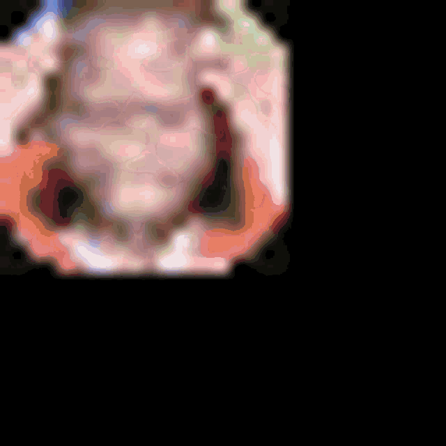 a blurred image of a person standing in front of a blue and green wall .