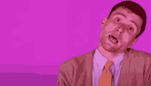 a pixel art of a man in a suit walking in a purple room