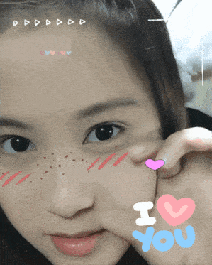 a girl with hearts on her face and the word i love you