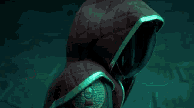 a blurry picture of a person 's face with a green light shining on it