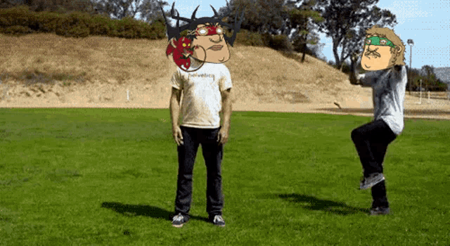 a man wearing a shirt that says hawksberg stands in the grass