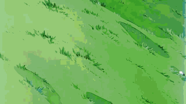 a close up of a person 's fist on a green field