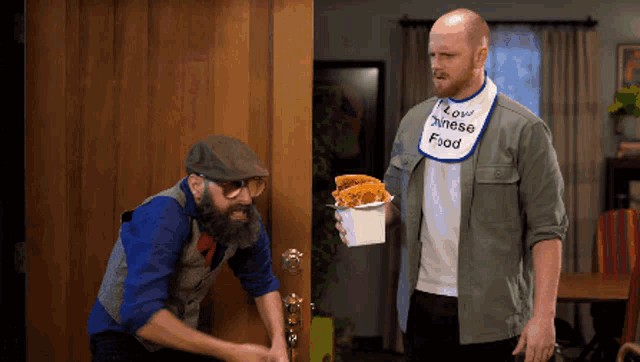 a man with a bib that says " low chinese food "