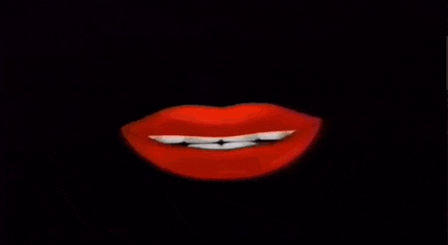 smoke is coming out of a candle on a black background .
