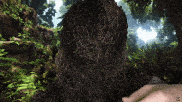 a close up of a person 's face with a hand reaching out to touch it