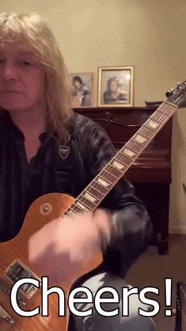 a man playing a guitar with the words cheers written on the bottom