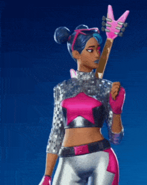 a girl is holding a pink guitar in her hand .