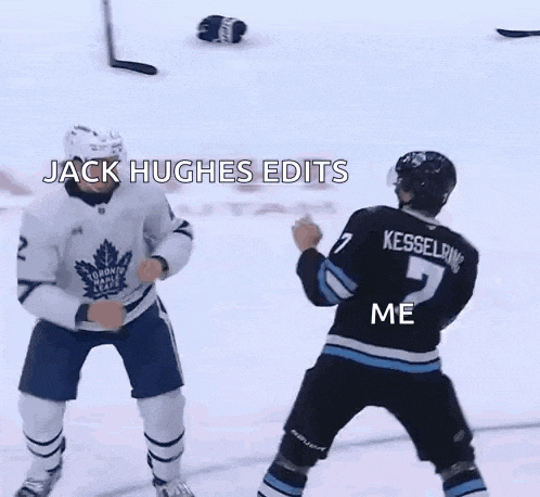 two hockey players are fighting on the ice and one of them is laying on the ground .