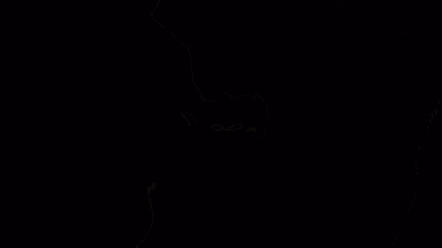 a person is standing in a dark room with a cigarette in their mouth