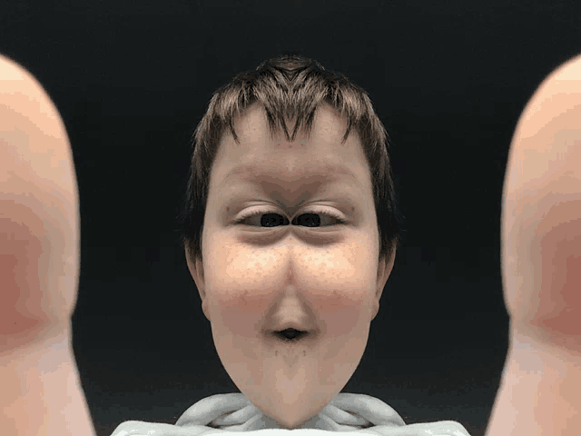 a close up of a person 's face with a funny expression