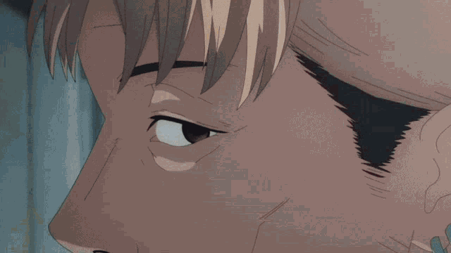 a close up of a person 's face with a serious look on it