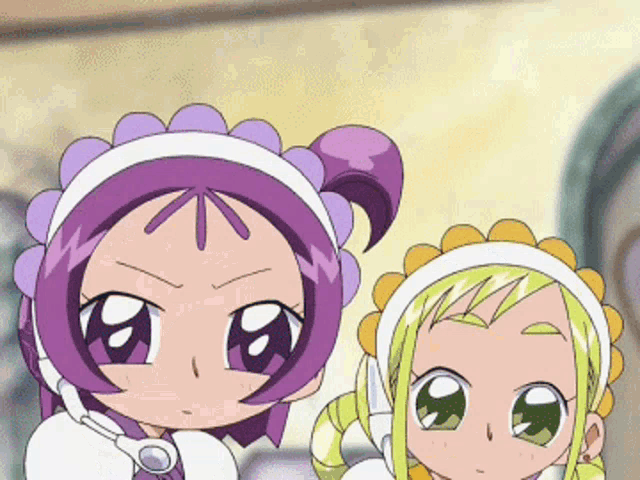 two cartoon characters are standing next to each other and one has a purple headband