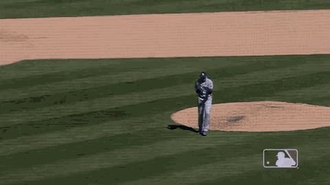 a baseball player wearing a rays jersey with a blue hat