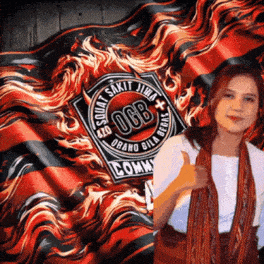 a woman giving a thumbs up in front of a flag with ogb on it