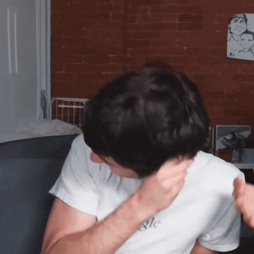 a man wearing a white shirt that says google