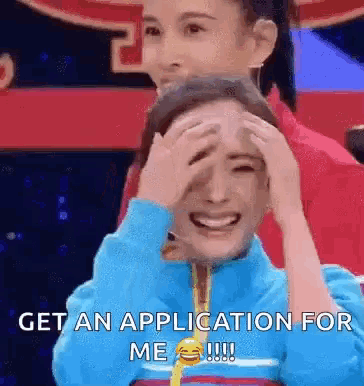 a woman is covering her face with her hands and says get an application for me