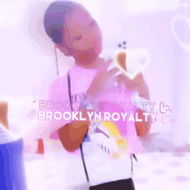 a girl wearing a pink shirt with the words brooklyn royalty on it