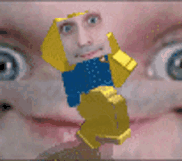 a close up of a person 's face with a yellow lego figure in front of it .
