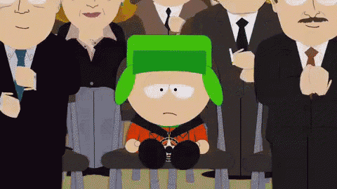 a cartoon character with a green hat is sitting in a chair