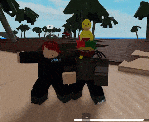 a person in a black shirt that says orbita is standing on a beach